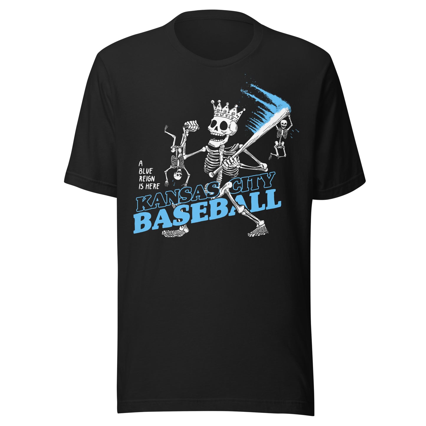 Black T-shirt featuring skeletons playing baseball, one with a crown and bat trailing a streak of blue, with the text ‘Kansas City Baseball’ and ‘A Blue Reign is Here.’