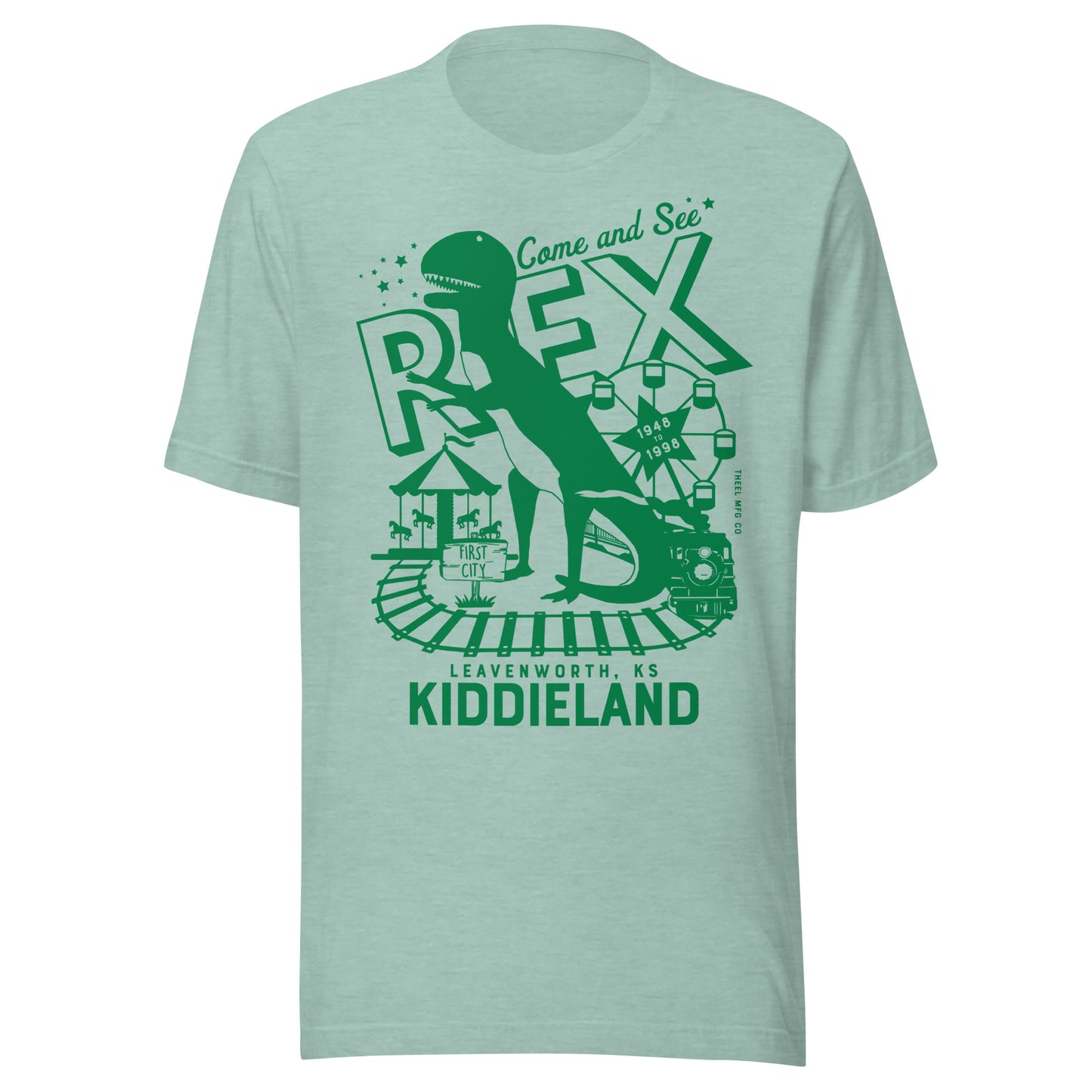 T-shirt featuring a retro green graphic of a dinosaur named Rex, a Ferris wheel, train tracks, and the text “Come and See Rex – Kiddieland – Leavenworth, KS – 1948–1998.”