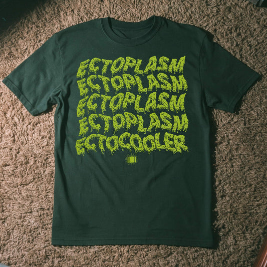 A forest green short-sleeve t-shirt laid flat on a brown carpeted floor, featuring the word 'ECTOPLASM' repeated in a yellow-green dripping font, with 'ECTOCOOLER' printed below in a smaller solid yellow-green font.