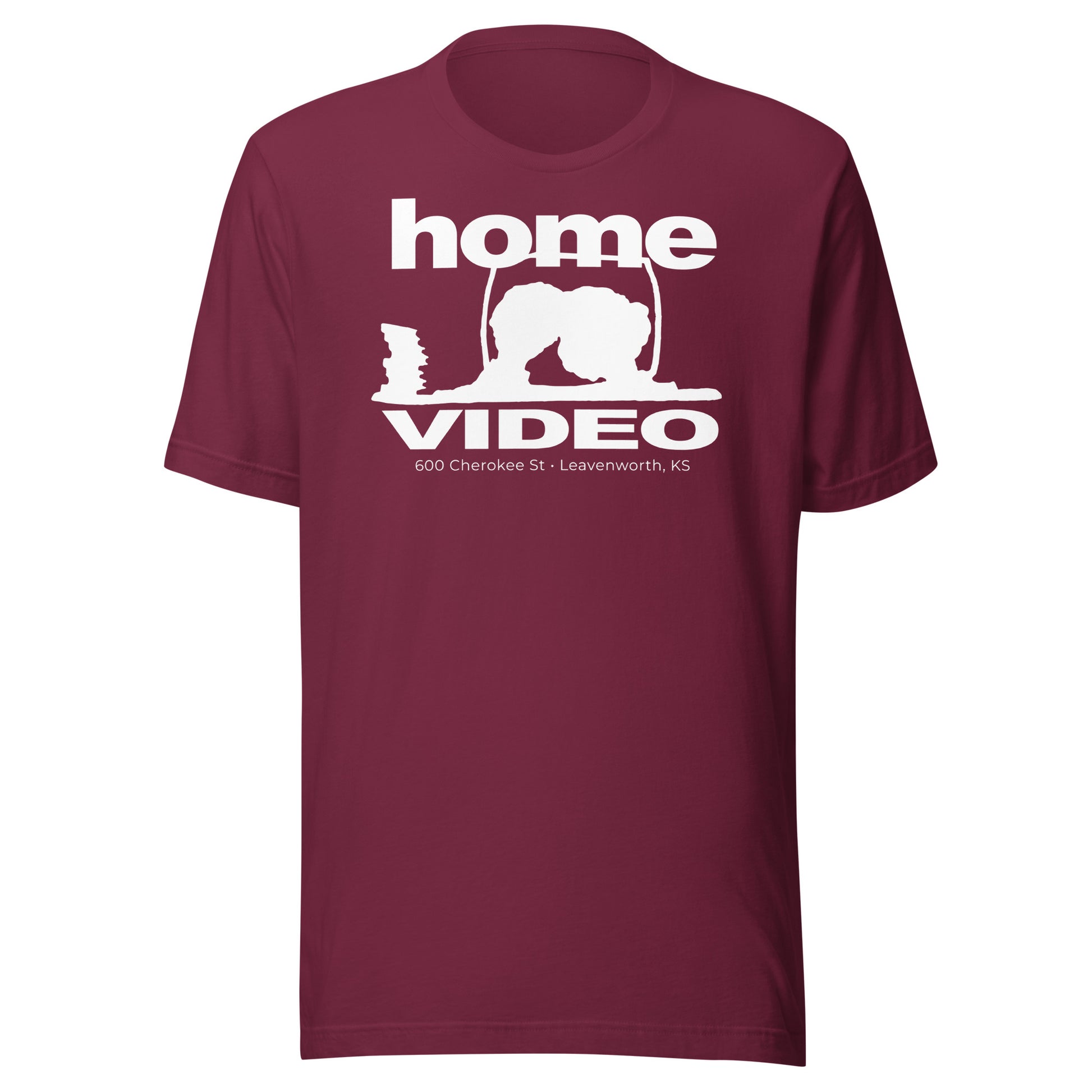Maroon T-shirt with a retro-style white logo reading “Home Video” and an outline of a person crouched near a TV screen, with text “600 Cherokee St • Leavenworth, KS.”