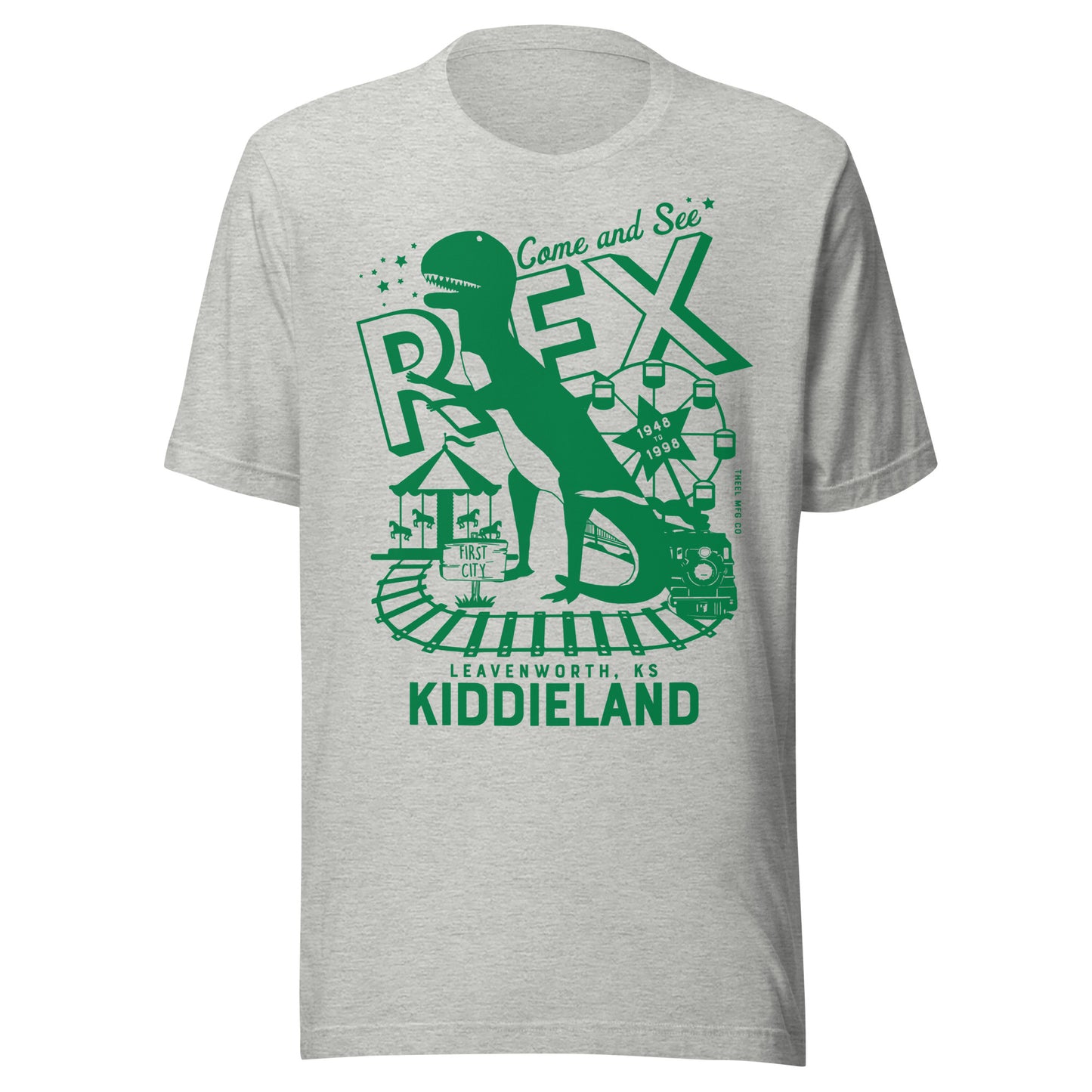 T-shirt featuring a retro green graphic of a dinosaur named Rex, a Ferris wheel, train tracks, and the text “Come and See Rex – Kiddieland – Leavenworth, KS – 1948–1998.”
