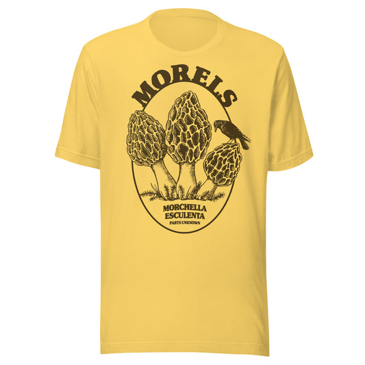 T-shirt featuring three illustrated morel mushrooms labeled “Morchella Esculenta,” with a perched crow and the phrase “Parts Unknown.”